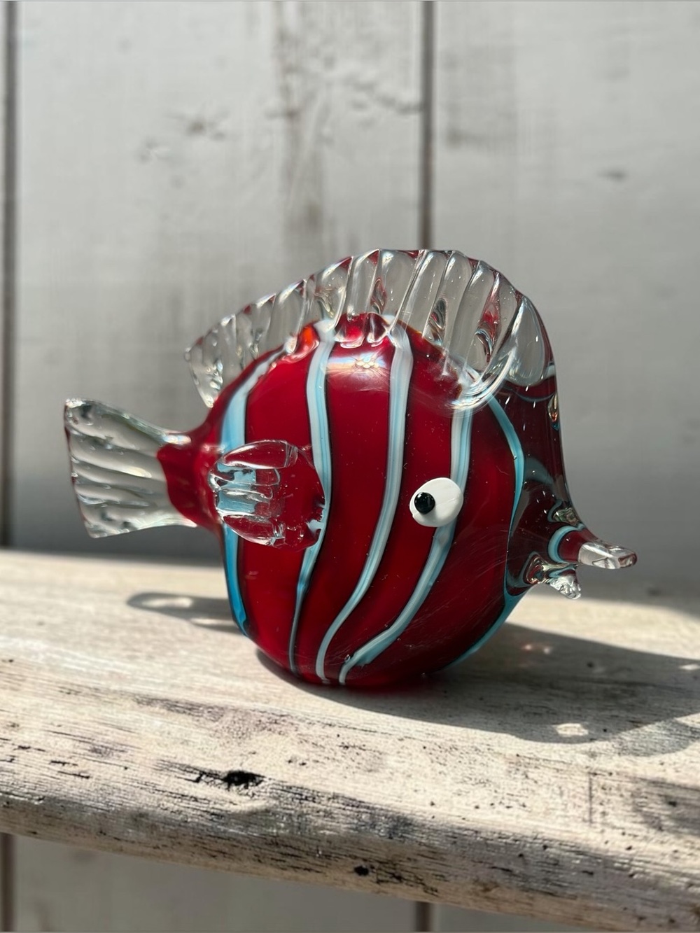 RED GLASS FISH FIGURINE WITH BLUE AND WHITE STRIPES